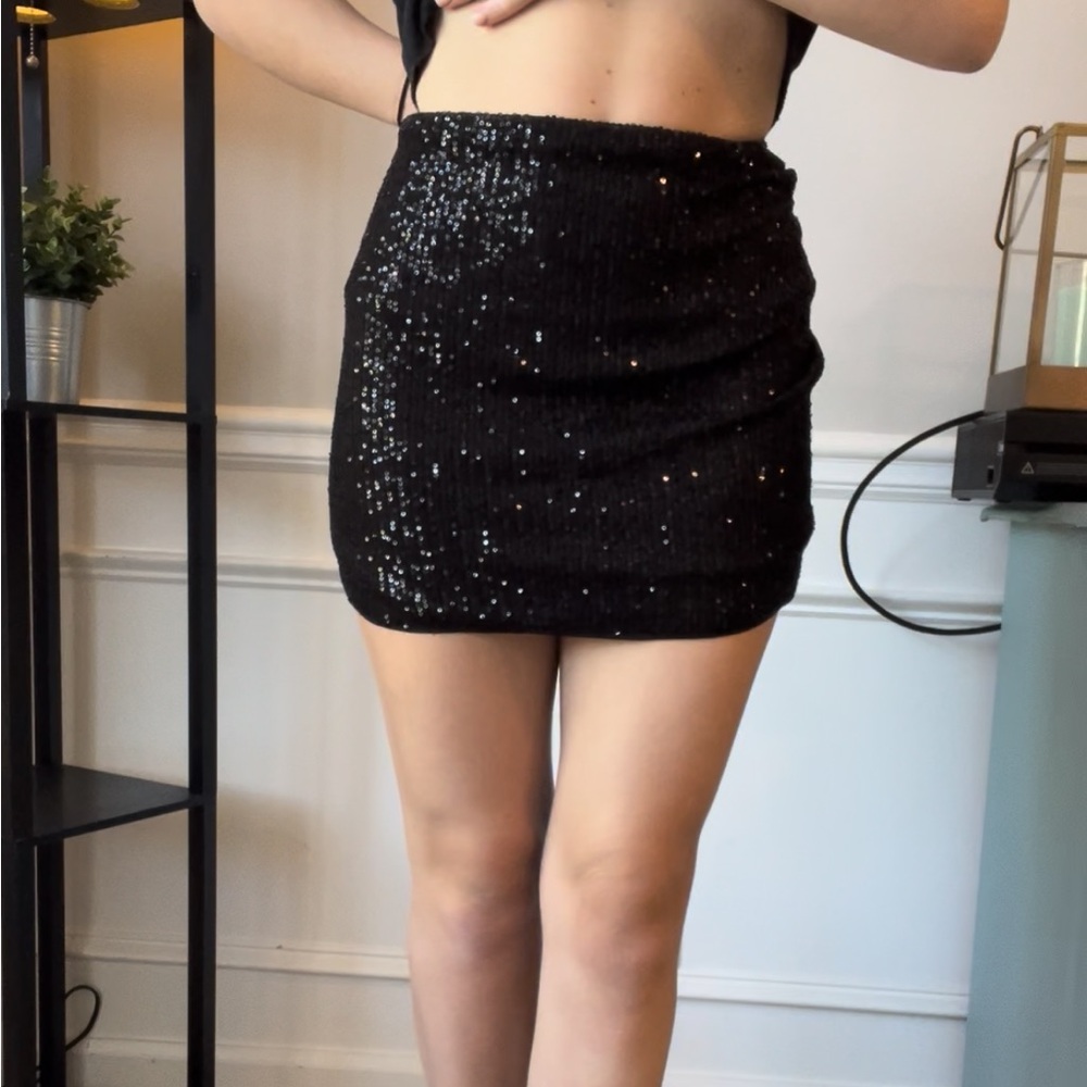 Black sequined mini skirt